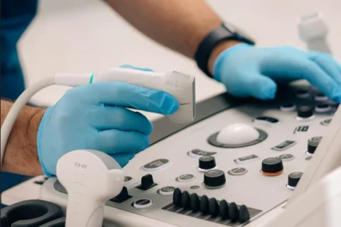 Doctor holding ultrasound tool