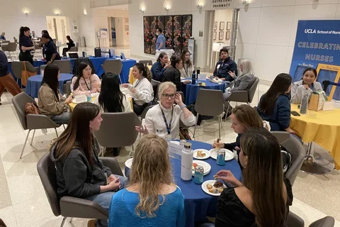 UCLA Nursing students speaking with a clinician at the 2024 Bruin Nurse Networking Night