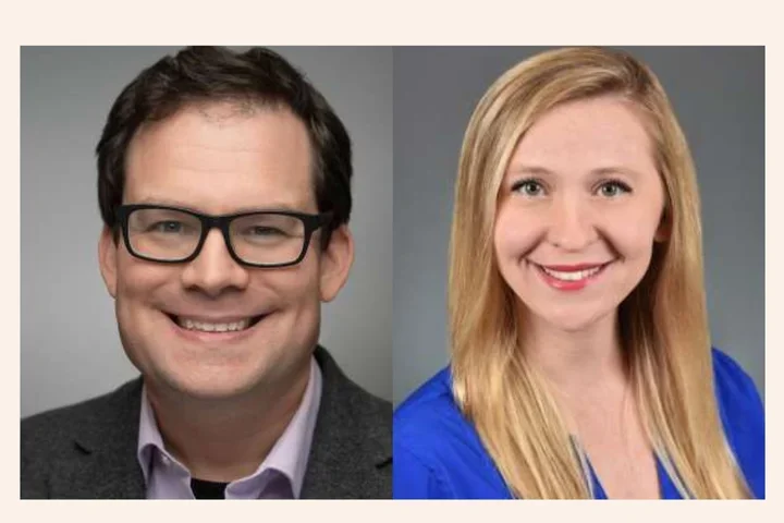 Man with glasses smiling and woman smiling