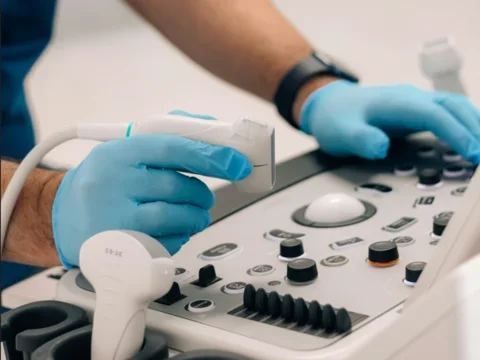 Doctor holding ultrasound tool