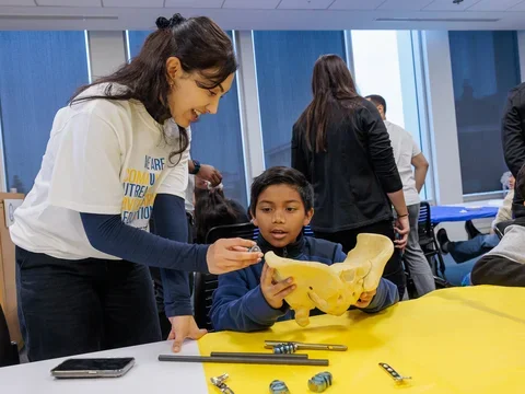 Medical student helping youth