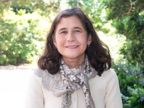 Dr. Yvonne Hernandez-Kapila standing in a garden
