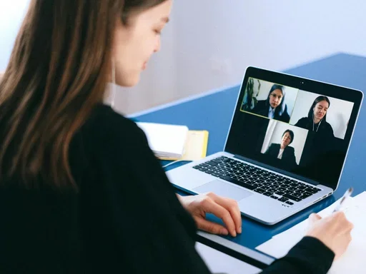 Woman on Zoom with other women